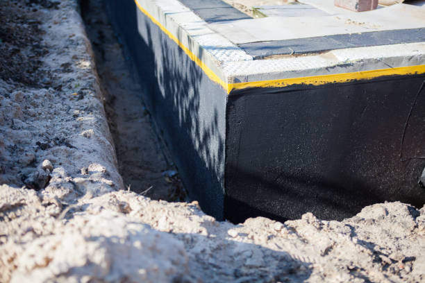 Professional Waterproofing technician working in Michigan City, IN